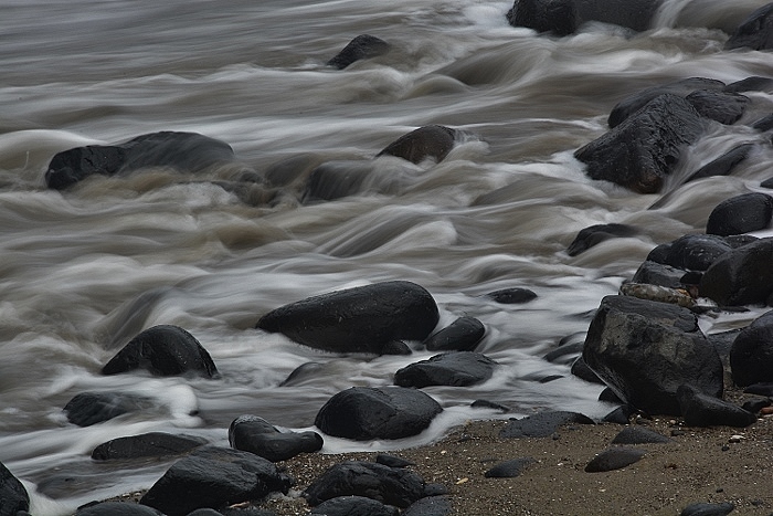 rushing water over rocks in slow motion